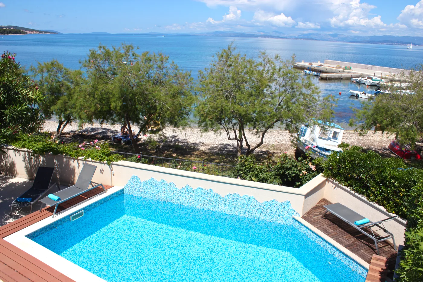Villa Mirca pool overlooking the sea and harbour, Brač Island, Croatia