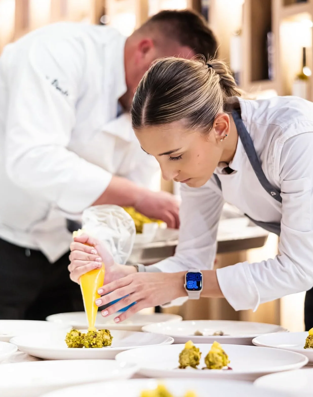 Chef Gaia Zec plating a dessert