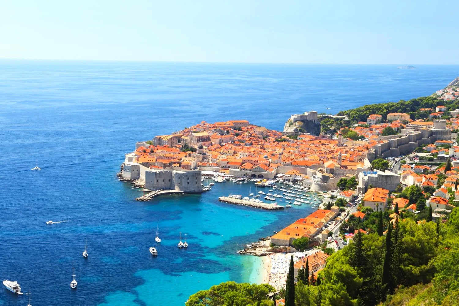 Dubrovnik walled old town and harbour above the turquoise Adriatic, Croatia