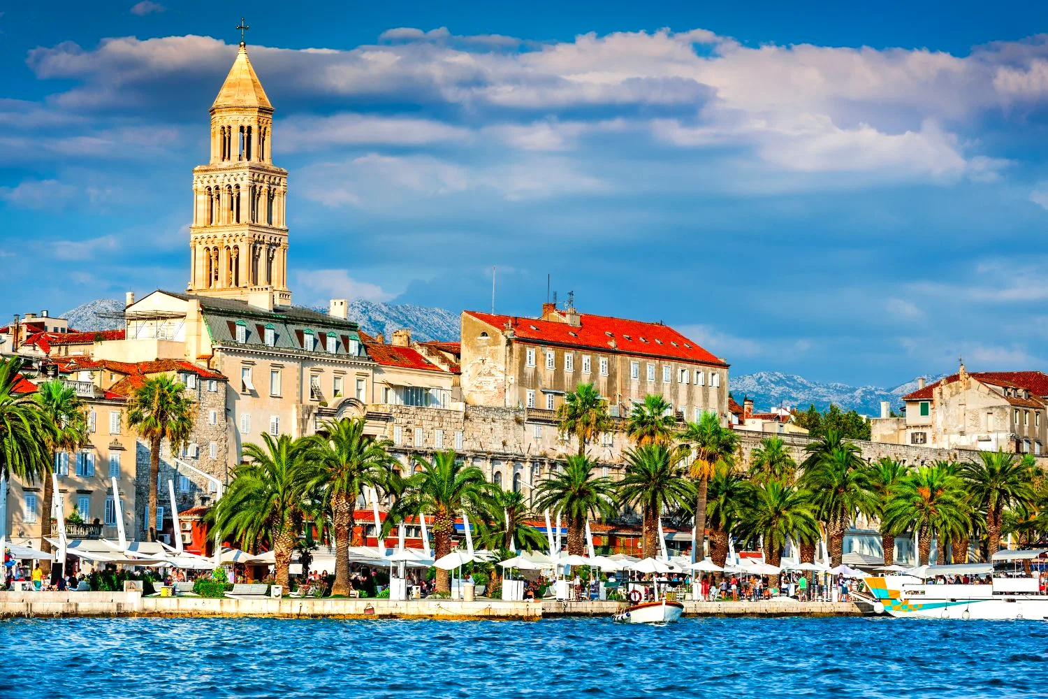 Split's Riva waterfront with St Domnius' bell tower rising over Diocletian's Palace, Croatia