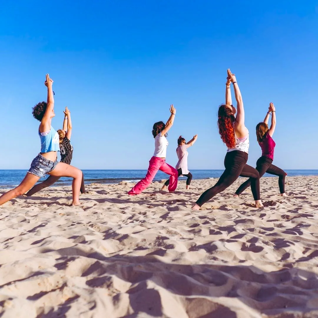 Group yoga at sunset on the Benissa coast, Costa Blanca, Spain