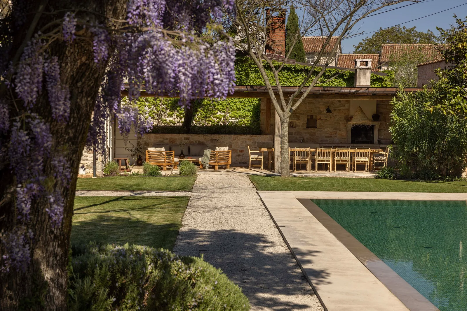 Wisteria in flower beside the pool terrace at Villas Prašćari, Istria, Croatia