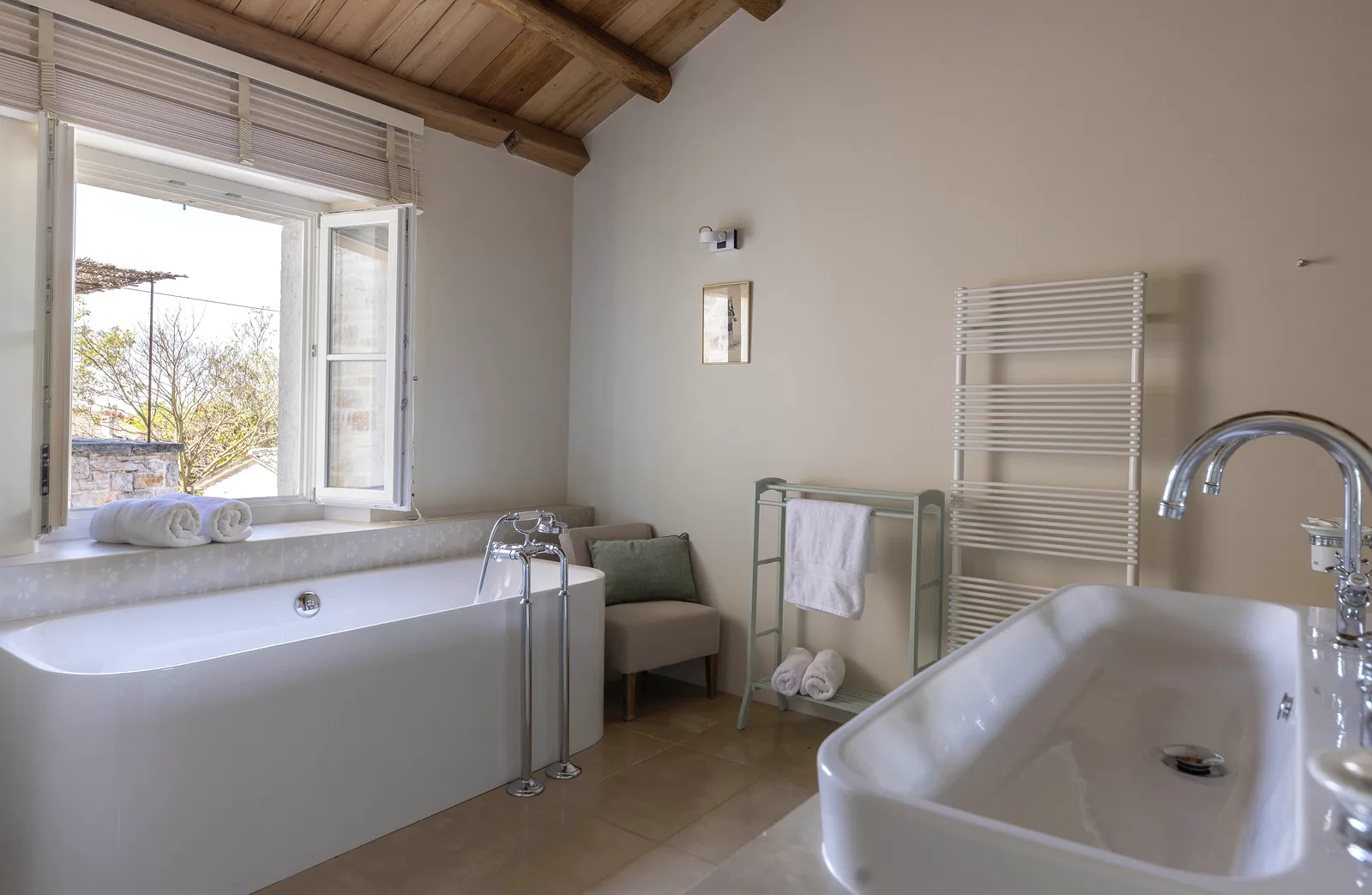 En-suite bathroom with freestanding tub at Villas Prašćari, Istria, Croatia