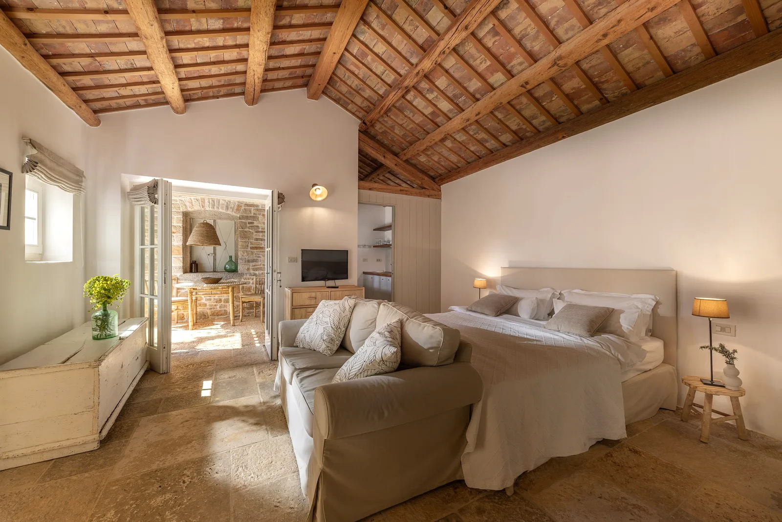 Bedroom suite with terracotta beamed ceiling at Villas Prašćari, Istria, Croatia