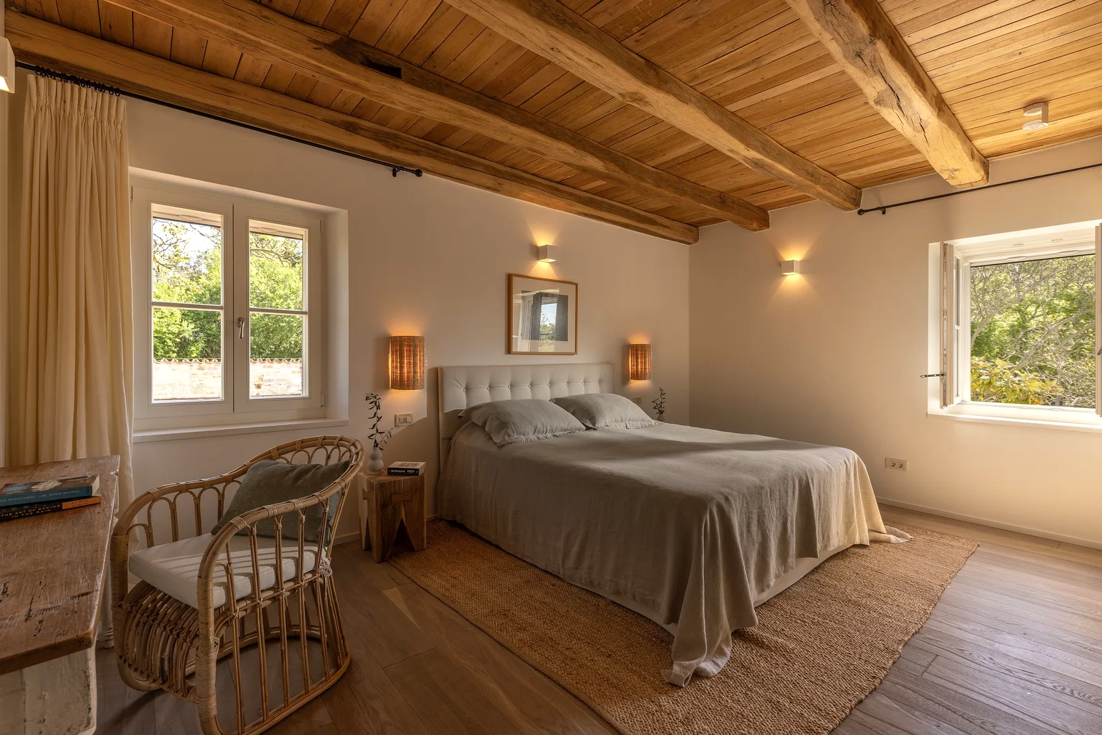 Bedroom with exposed wood-beam ceiling at Villas Prašćari, Istria, Croatia