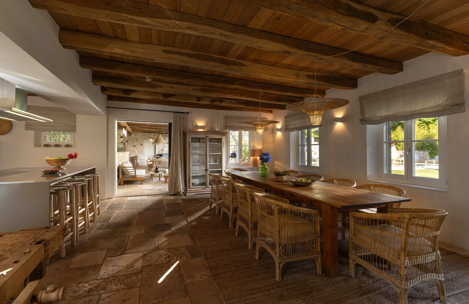 Communal dining table under a wood-beam ceiling at Villas Prašćari, Istria, Croatia
