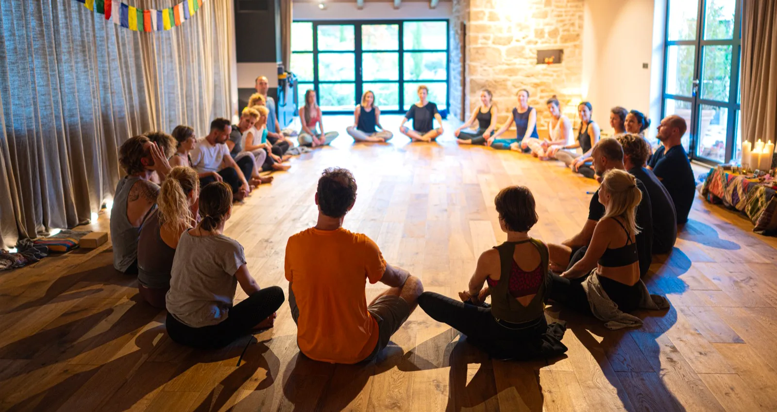 Group yoga circle inside the wood-beamed studio at the Istria retreat villa