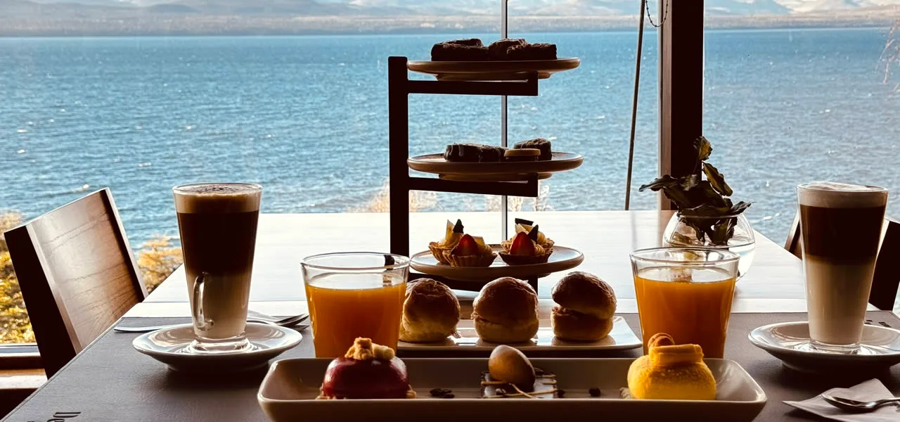 Coffee and dessert platter with lake view near Bariloche, Argentina
