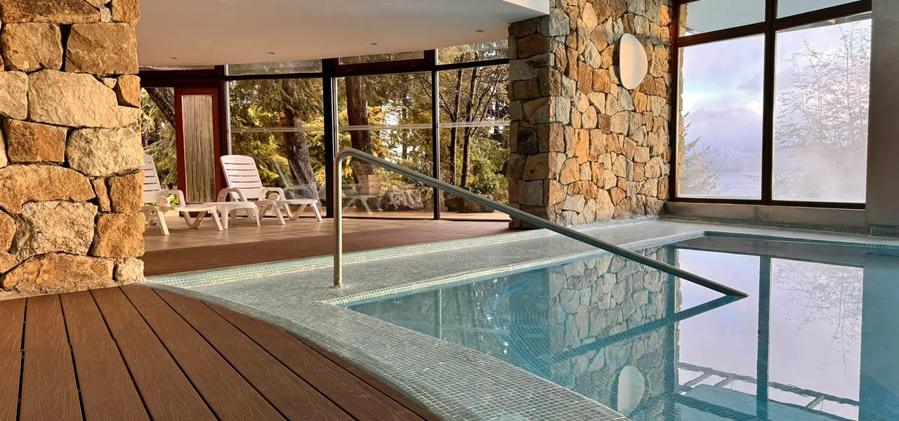 Indoor heated pool with lake view at Design Suites Bariloche, Argentina