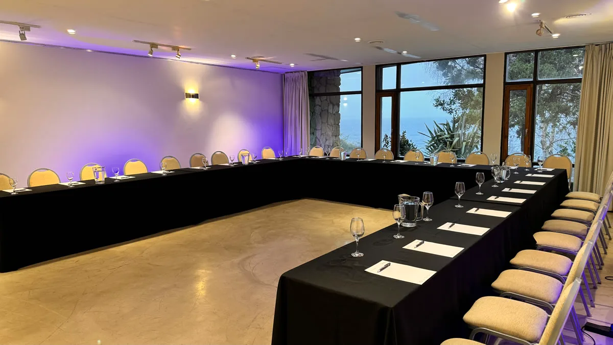 Event room set up conference-style with lake view, Design Suites Bariloche, Argentina