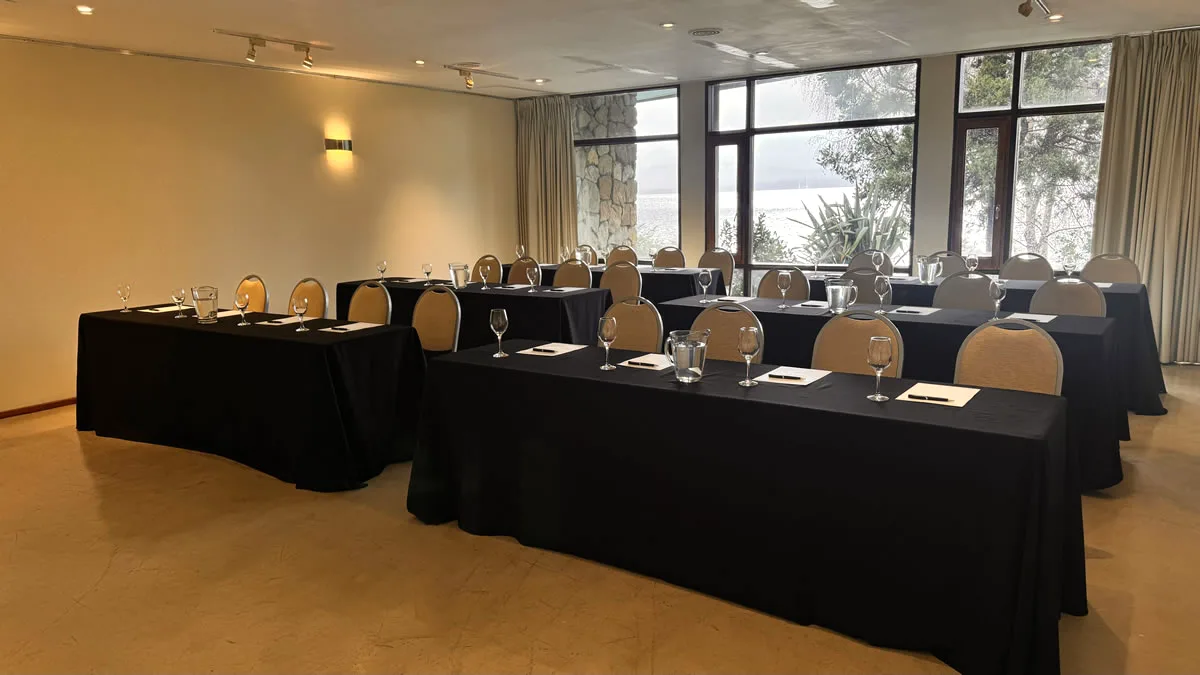 Design Suites Bariloche event room with lake-facing windows, Argentina