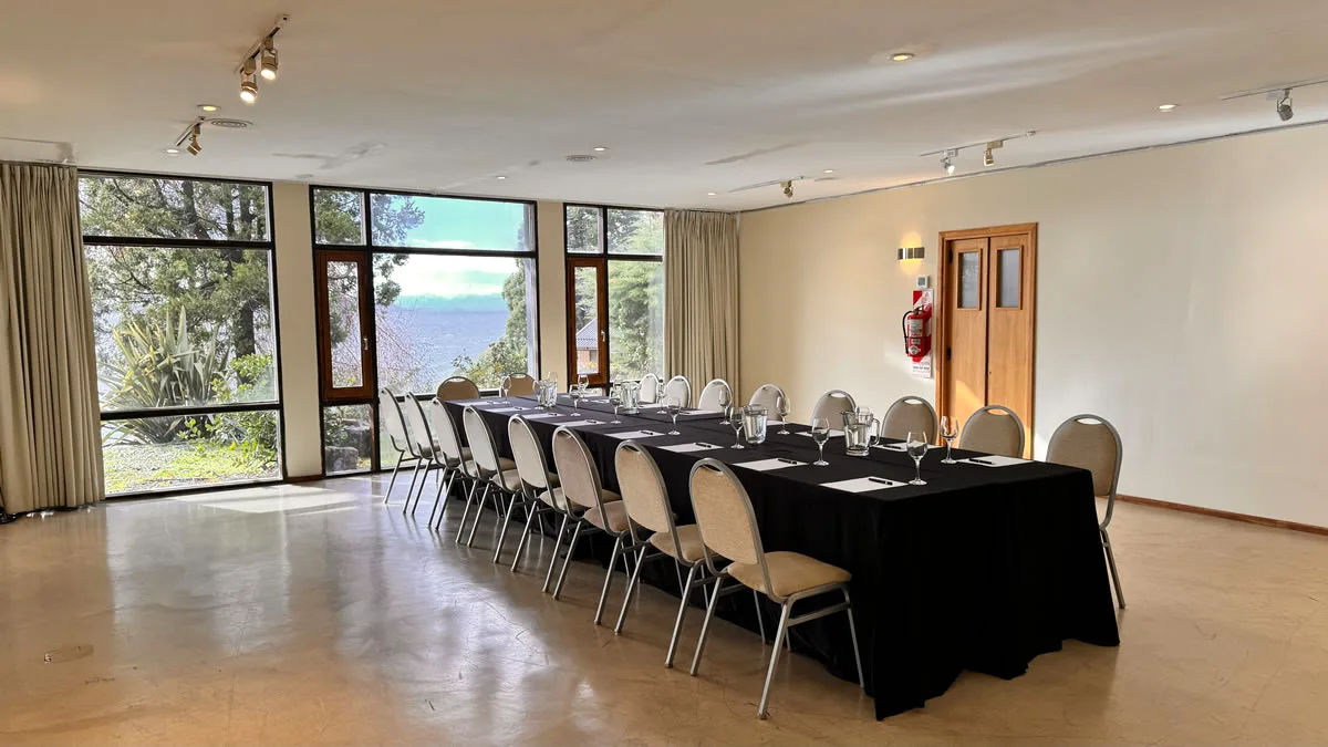 Design Suites Bariloche event room with natural light and forest view, Argentina