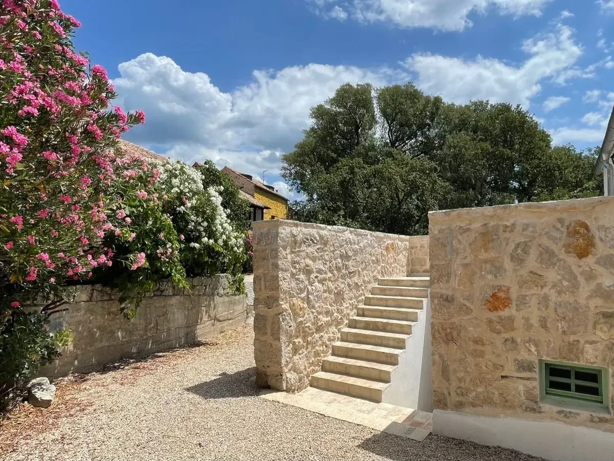 Stone staircase framed by oleander at Hotel Balatura, Tribalj, Croatia