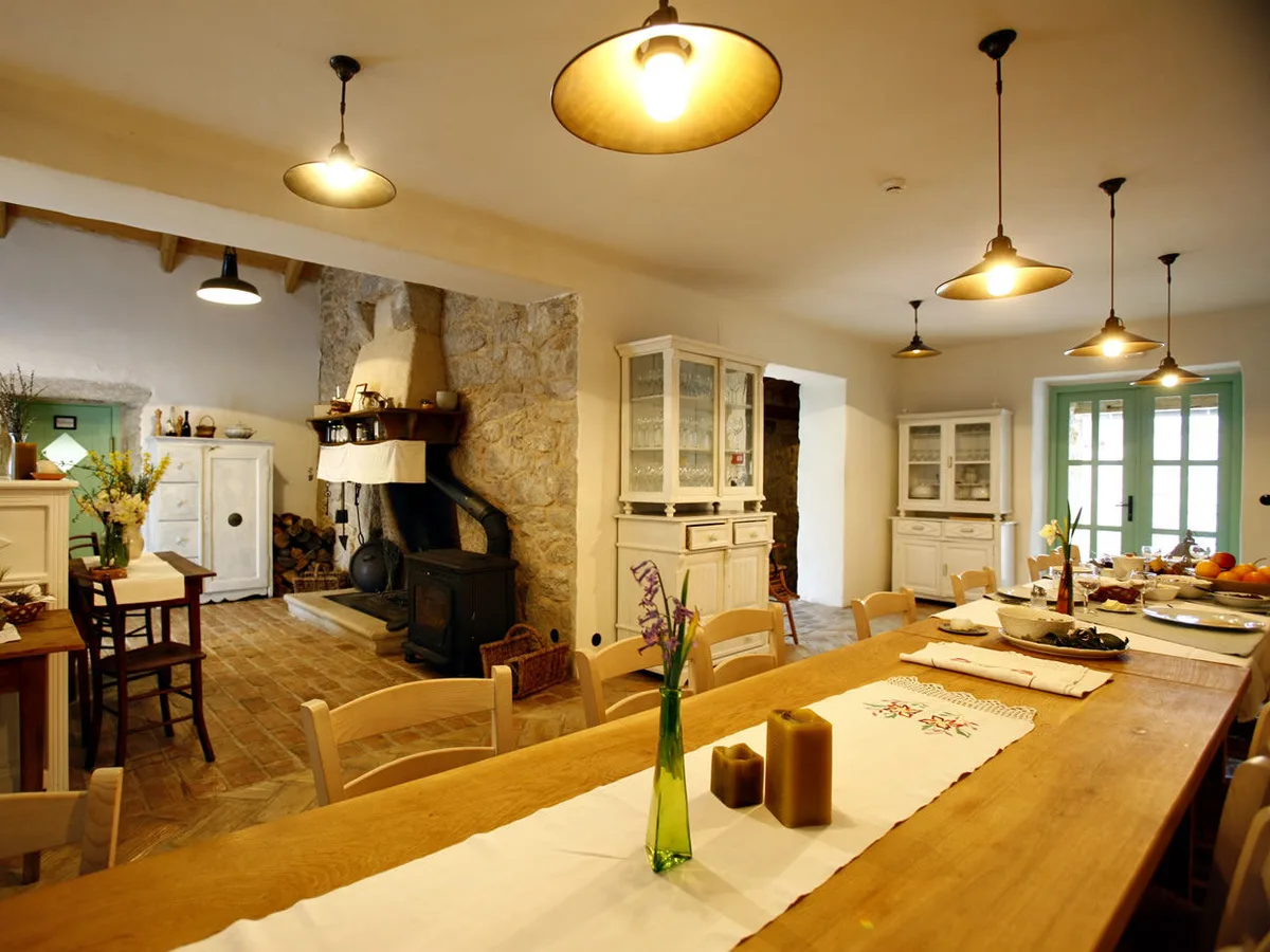 Dining room warmed by an old wood stove at Hotel Balatura, Vinodol Valley, Croatia