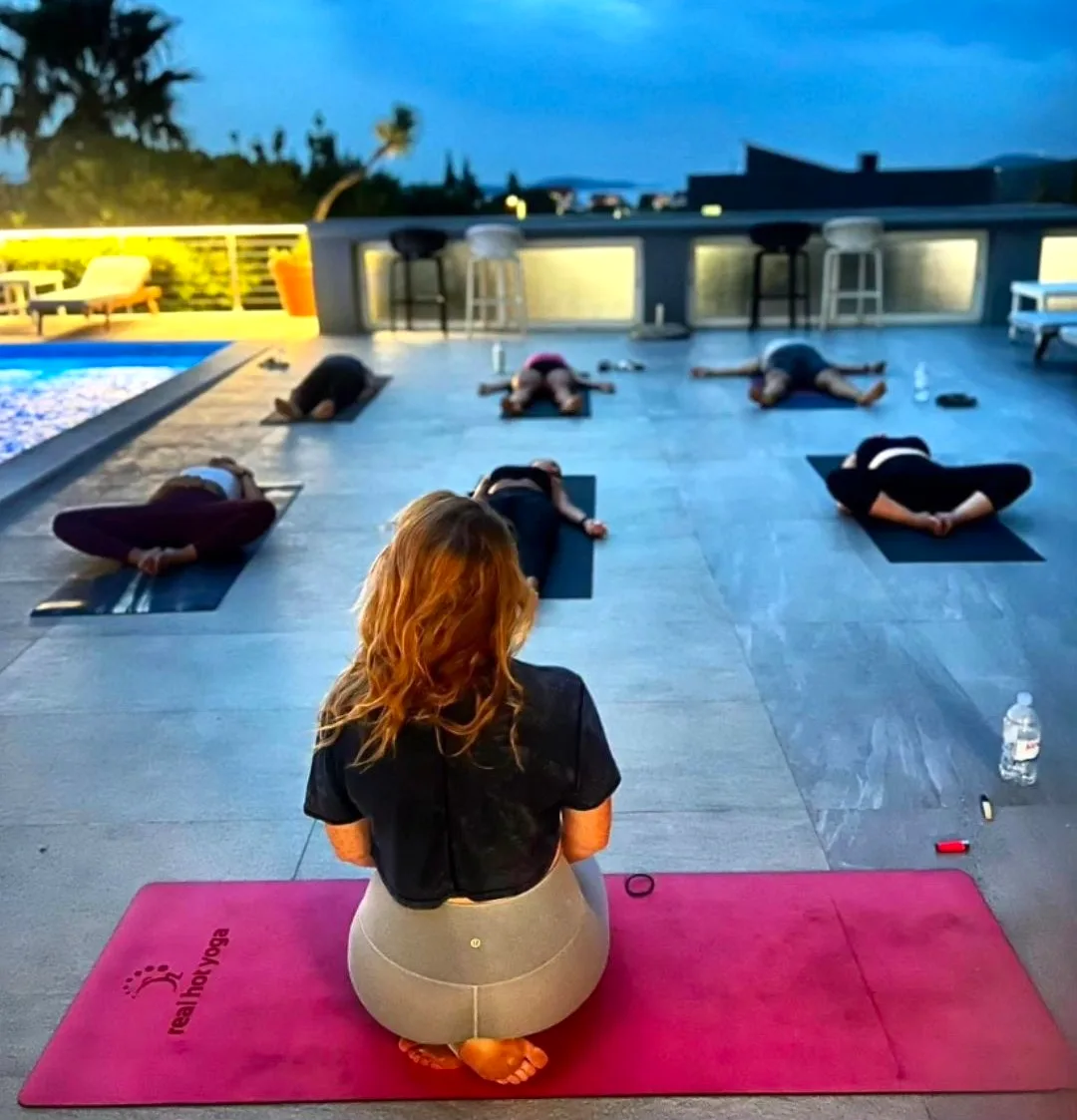 Yoga by the pool at dusk overlooking Hvar Town, B&B Dela, Croatia