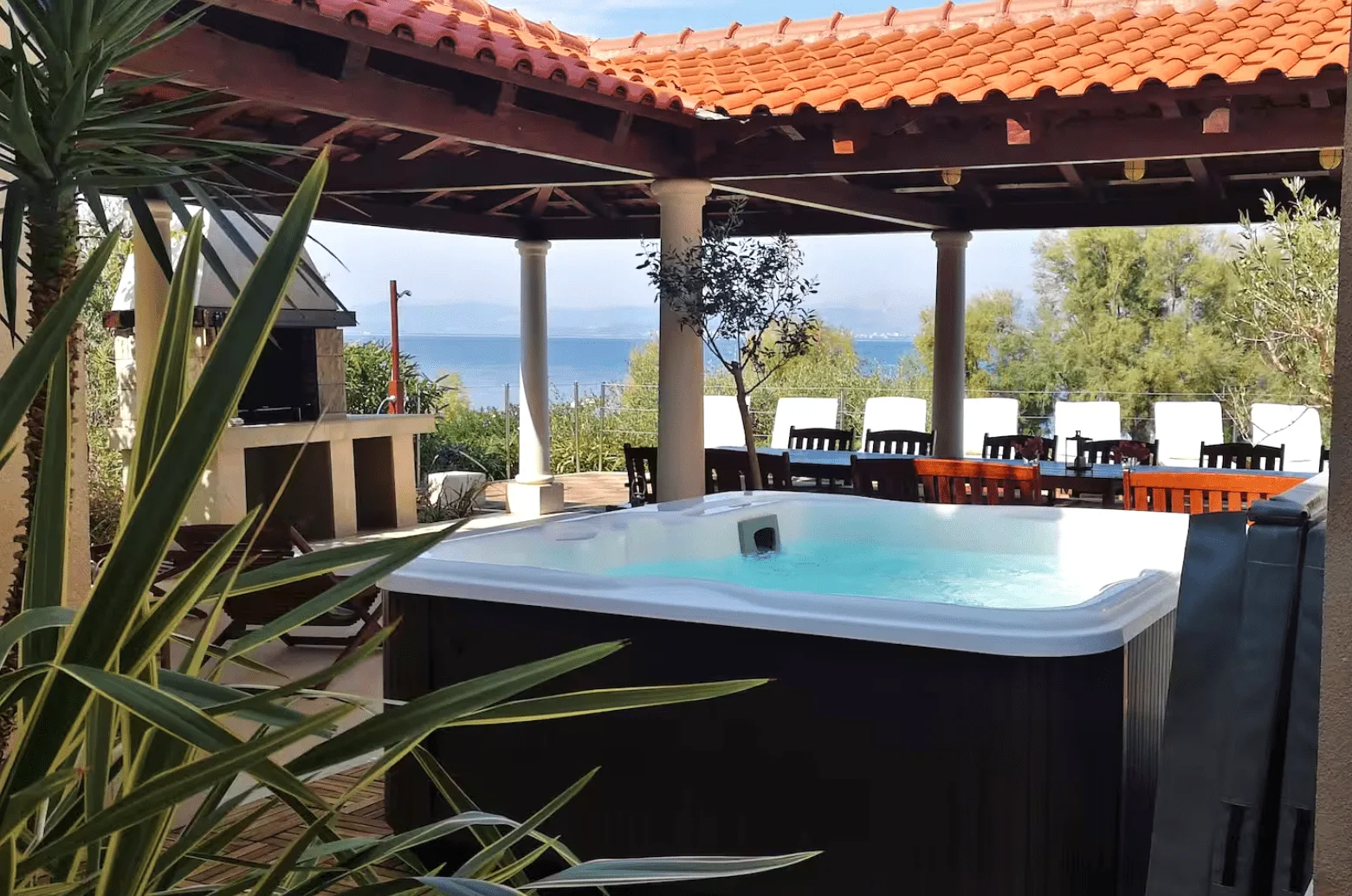 Covered terrace jacuzzi with sea view at Villa Gumonca, Brač Island, Croatia