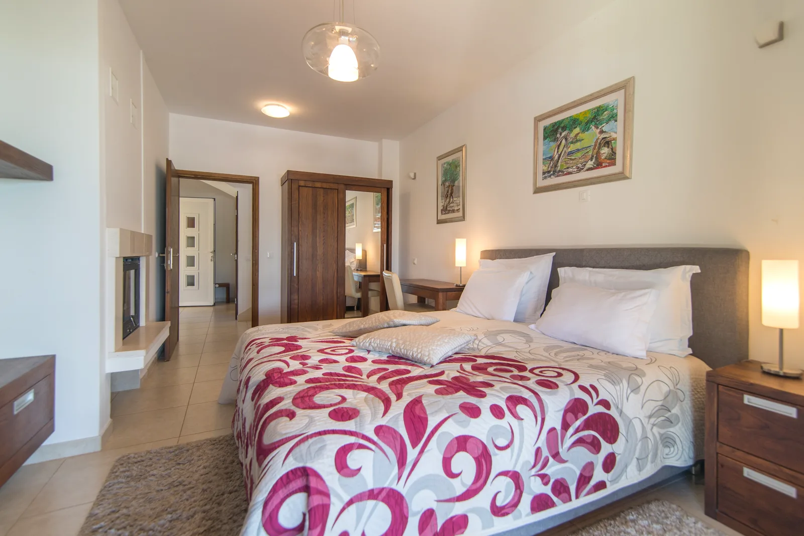 Bedroom with a stone fireplace at Villa Gumonca, Brač Island, Croatia