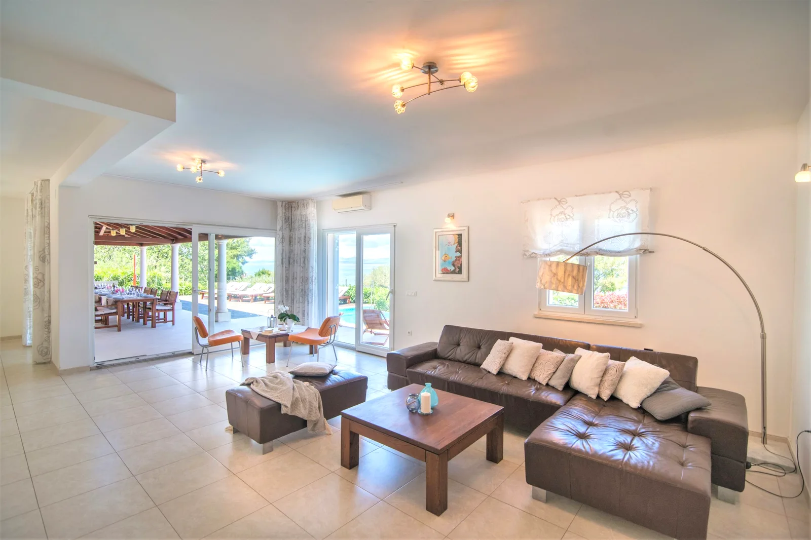 Living room with sea-view terrace doors at Villa Gumonca, Brač Island, Croatia