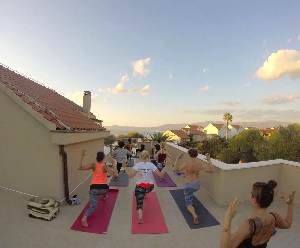 Sunset yoga practice on the rooftop terrace at Villa Gumonca, Brač Island
