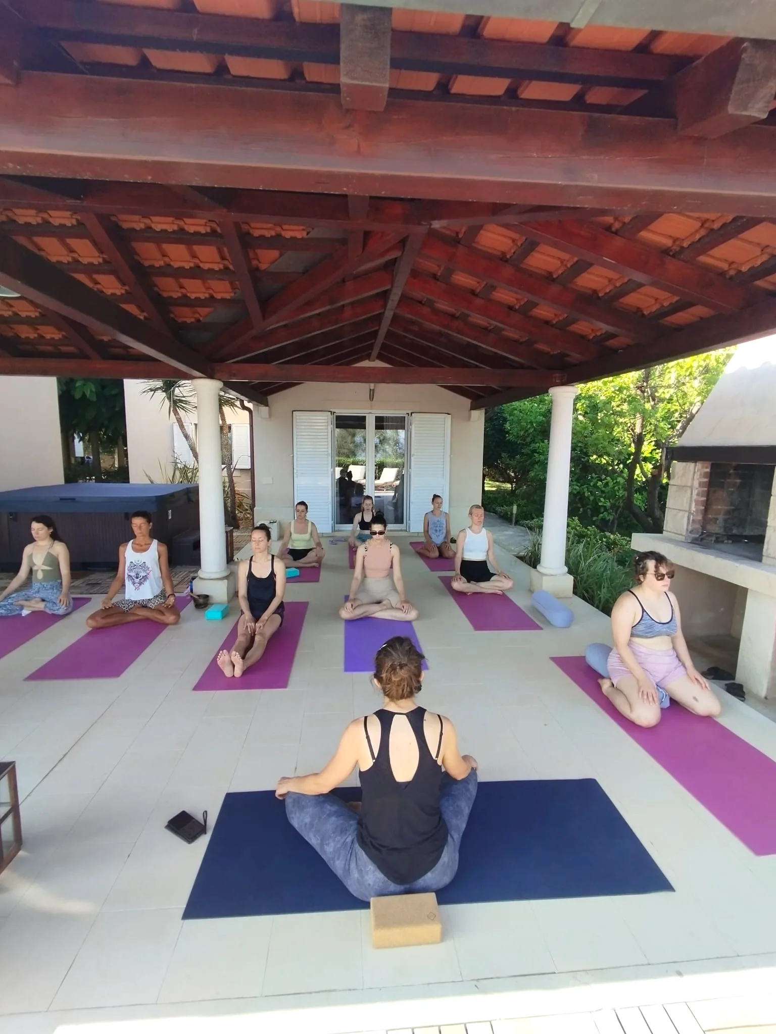 Seated meditation on the terrace near the outdoor fireplace at Villa Gumonca, Brač Island
