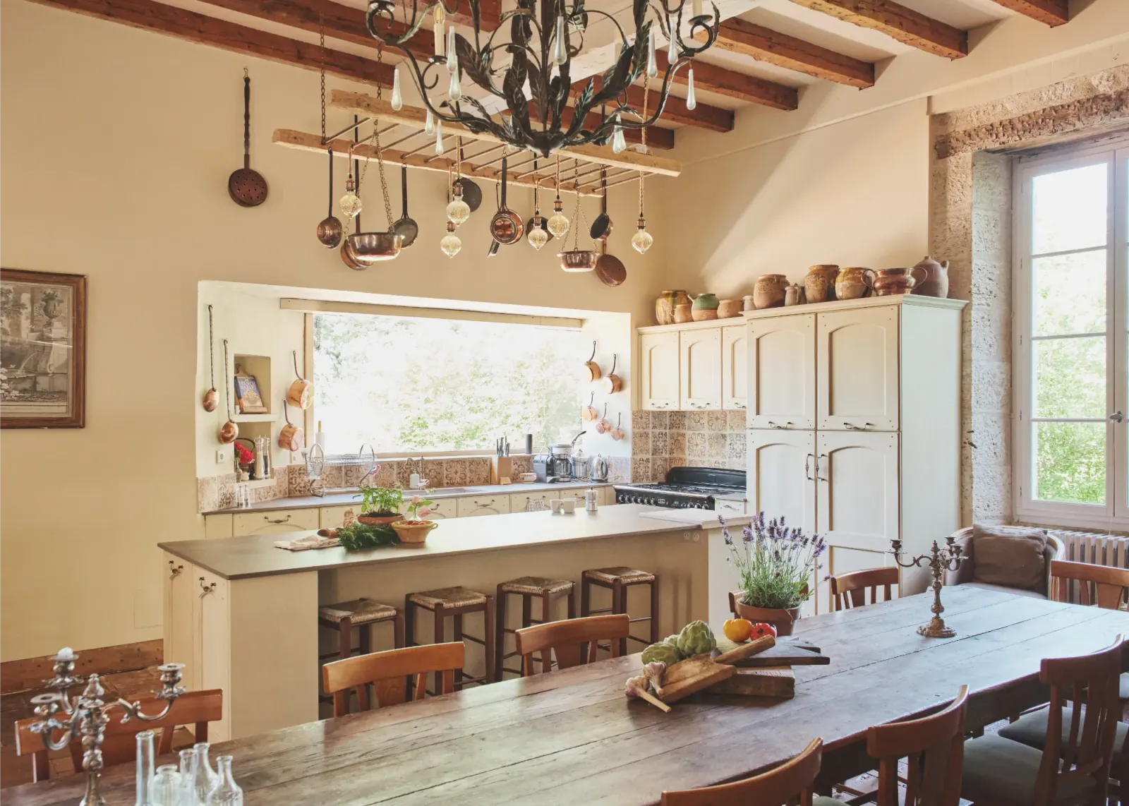 Large kitchen and dining area in the grand salon at Château de Lassalle, France