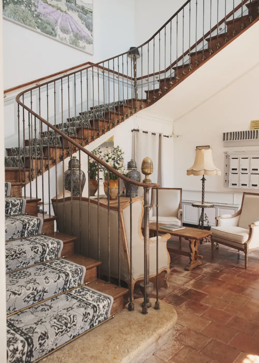 Reception hall with staircase at Château de Lassalle, France