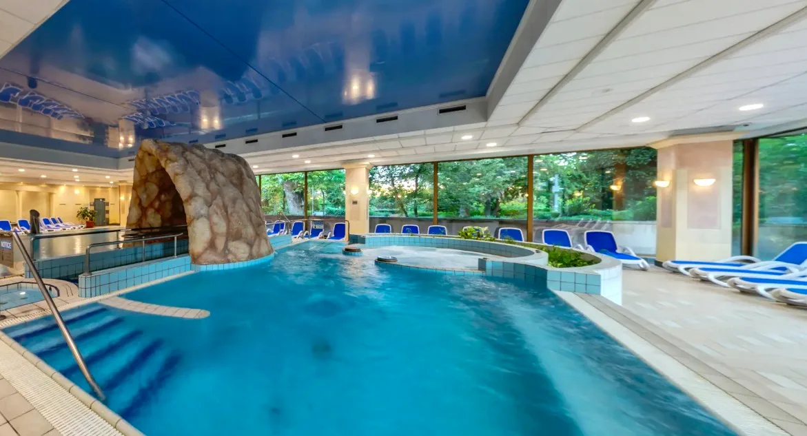 Indoor pool with water slide at Ensana Thermal Margaret Hotel, Budapest