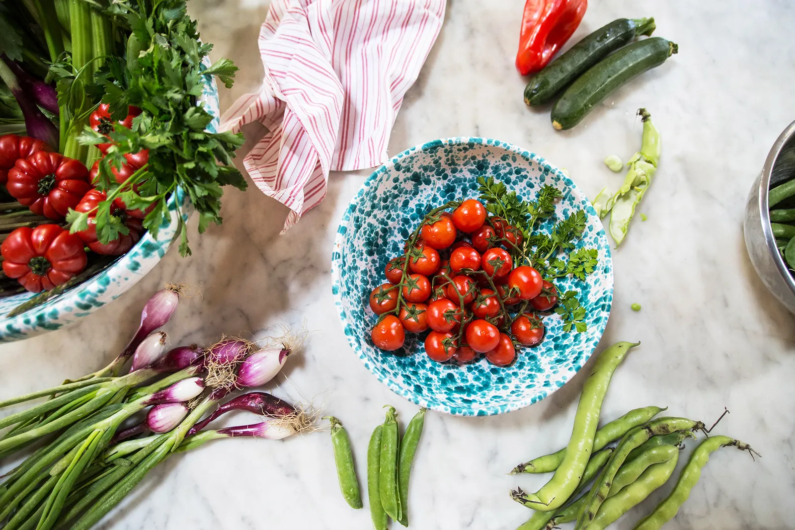 Fresh tomatoes, spring onions and vegetables prepared in the Sicilian Spirit kitchen, Sicily
