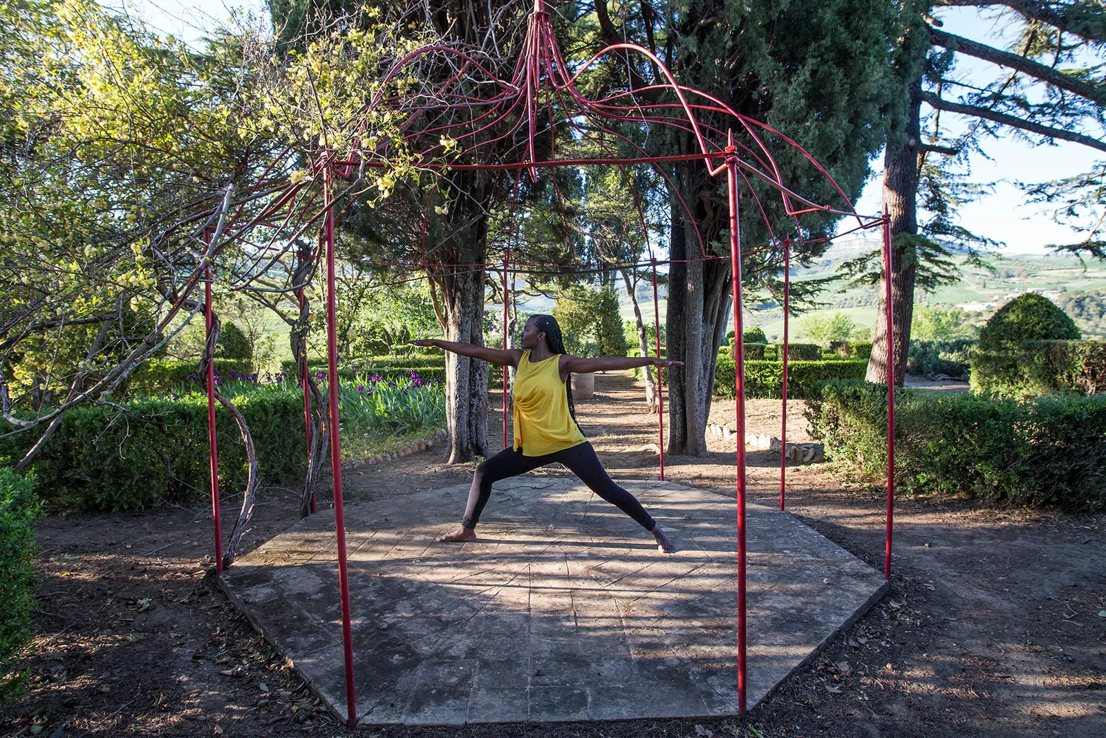 Yoga pose in the hedged garden at Sicilian Spirit, Sicily