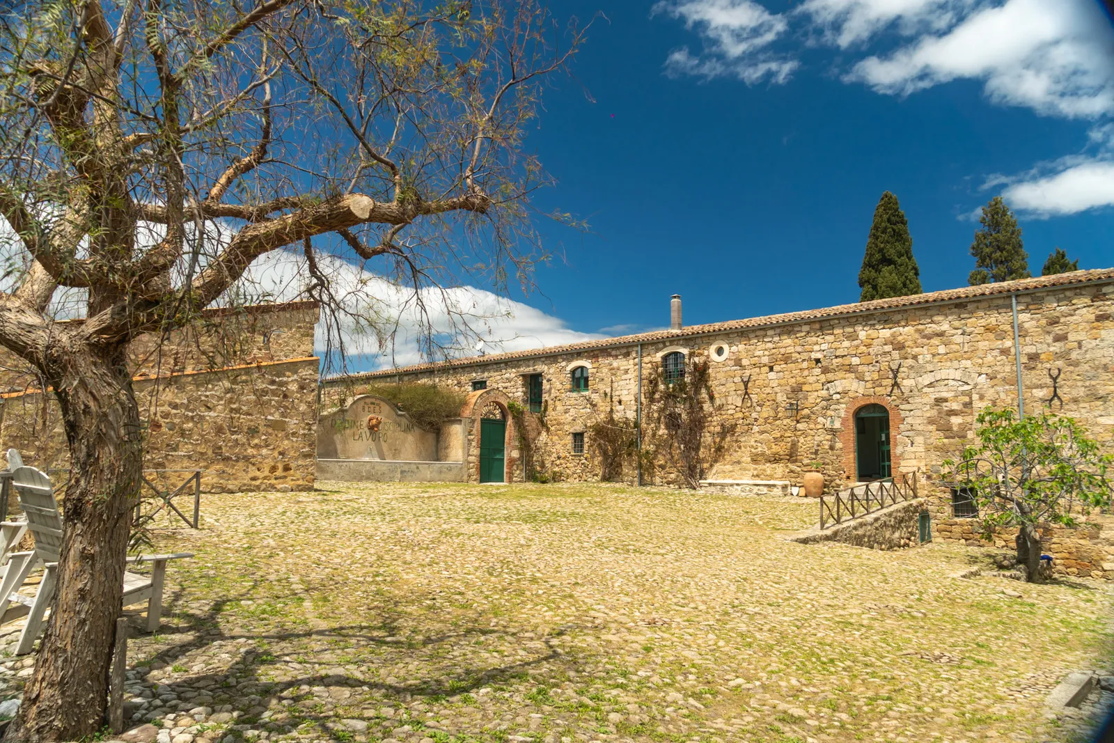 The stone Masseria farmhouse and courtyard at Sicilian Spirit, Petralia Soprana, Sicily
