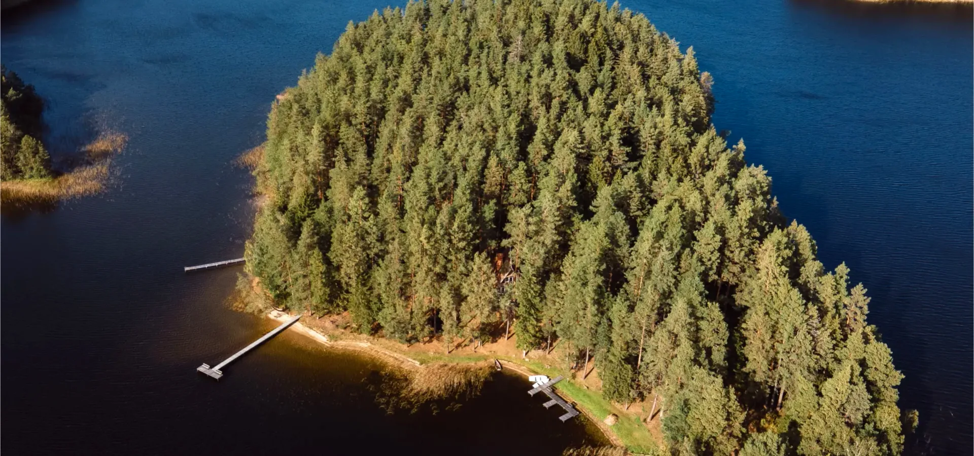 Aerial view of the forest peninsula and lake at Šiaurys Resort, Labanoras Forest, Lithuania
