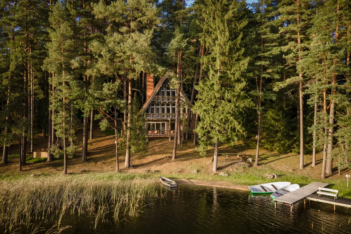 Lakeside lodge with a private dock and rowboats at Šiaurys Resort, Lithuania
