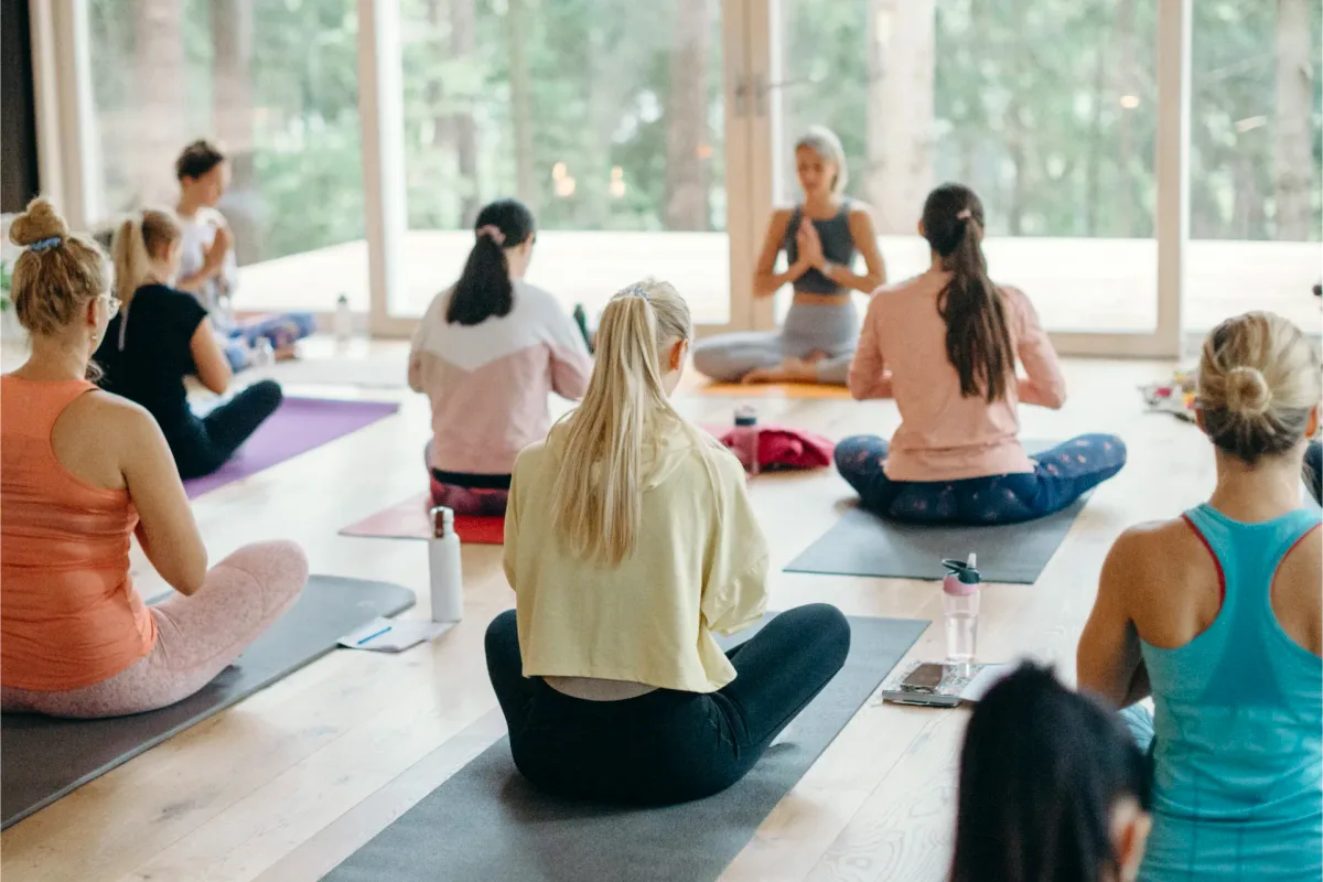 Group yoga and meditation session inside the activities house at Šiaurys Resort, Lithuania