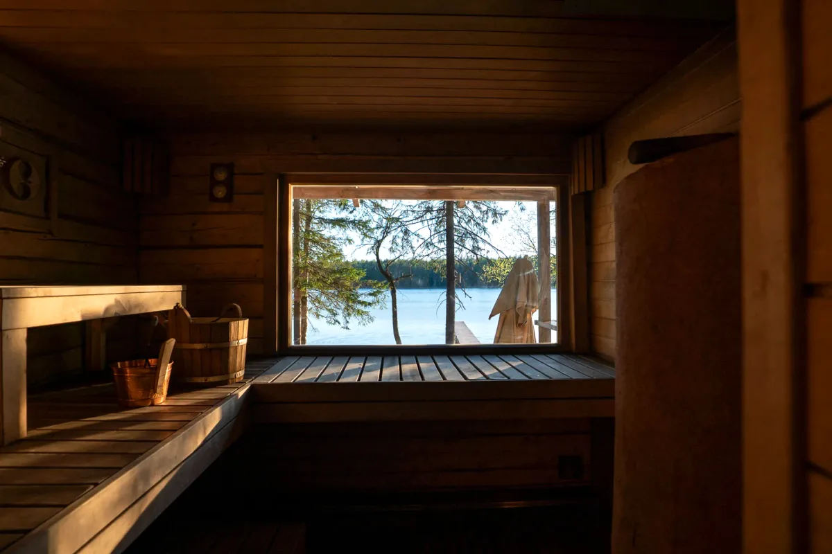 Sauna bench looking out over the lake through a picture window at Šiaurys Resort, Lithuania