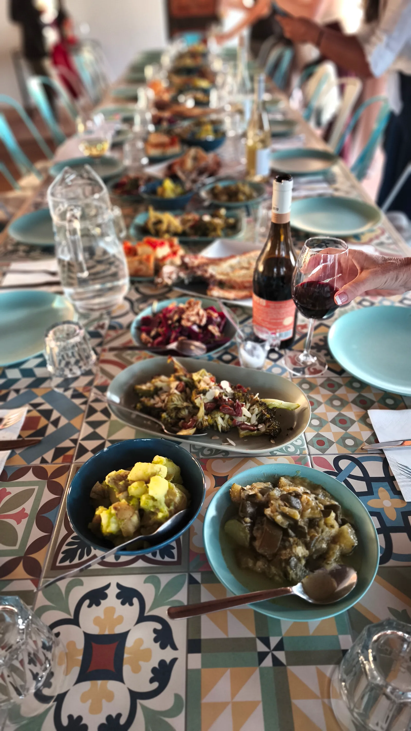 Long communal dinner table set for a retreat group at Villa Vale a Pena, Algarve
