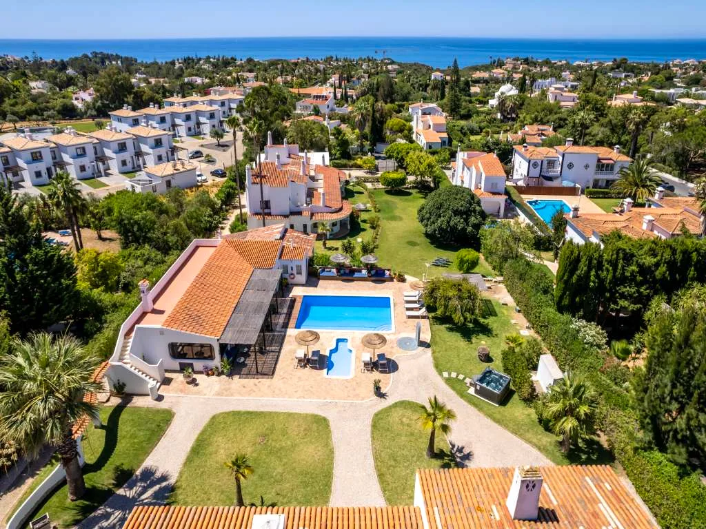Aerial view of Villa Vale a Pena's pool and gardens, retreat venue near Carvoeiro, Algarve, Portugal