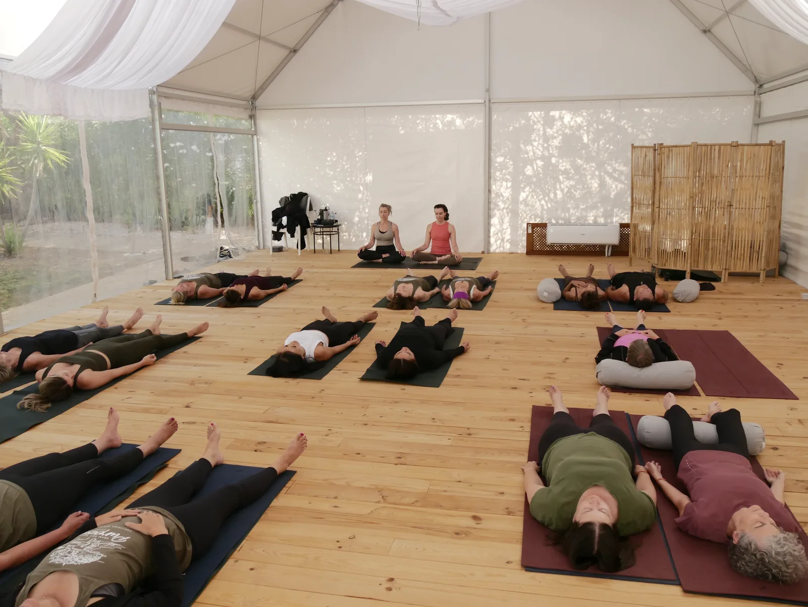 Teacher-led meditation inside the covered yoga tent at Villa Vale a Pena, Algarve, Portugal