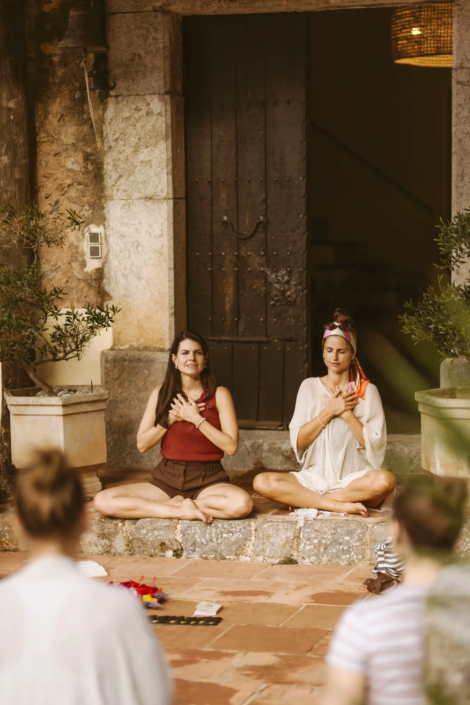 Retreat group gathered in the courtyard at dusk, Finca Higo, Mallorca