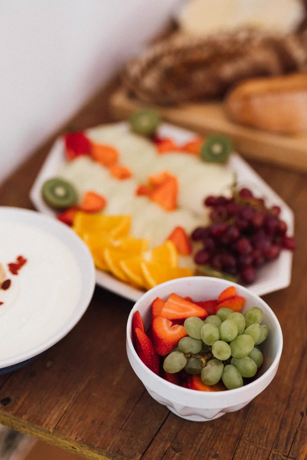 Fresh fruit bowl with strawberries and grapes at brunch, Mallorca retreat