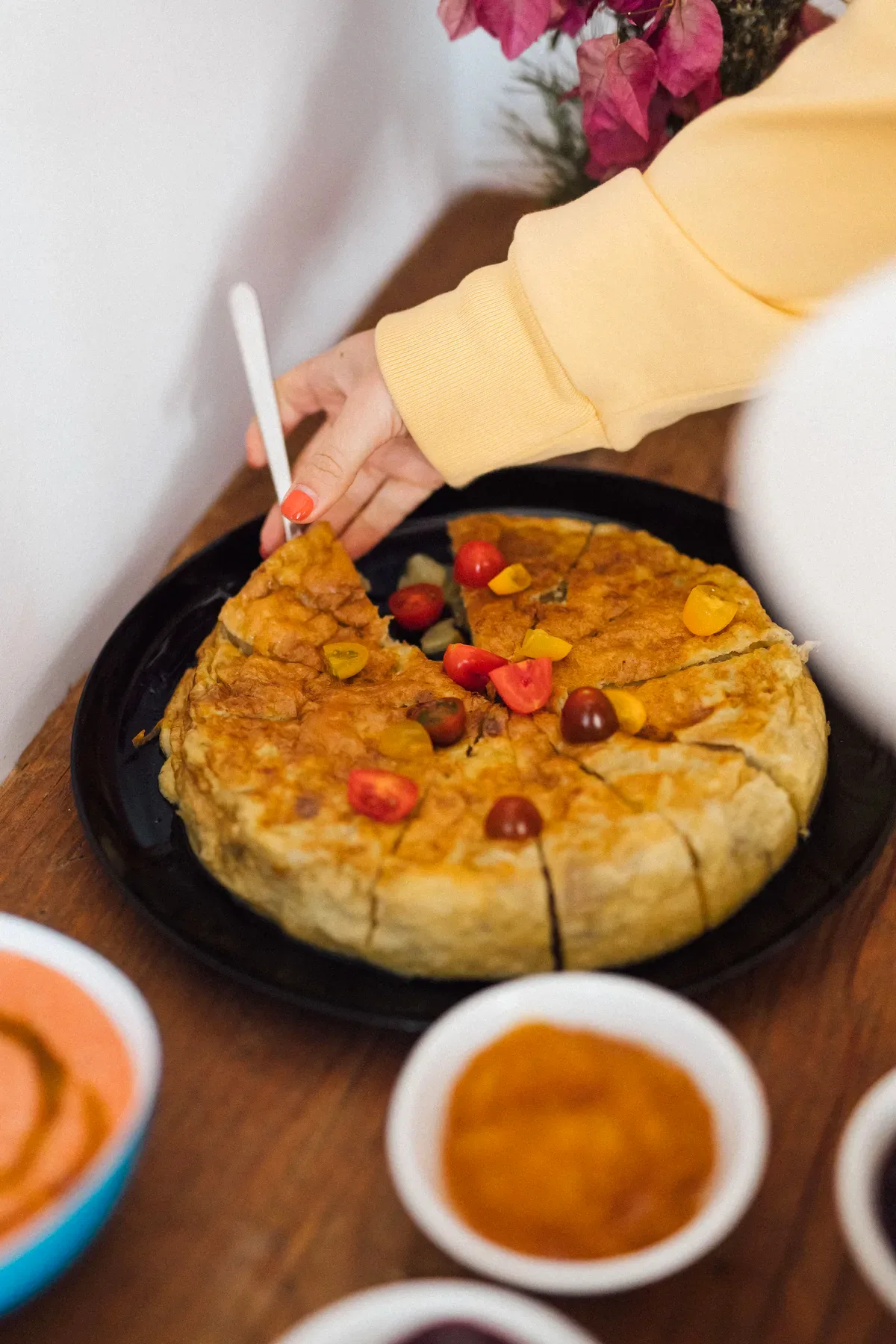 Spanish tortilla with cherry tomatoes served at brunch, Mallorca retreat