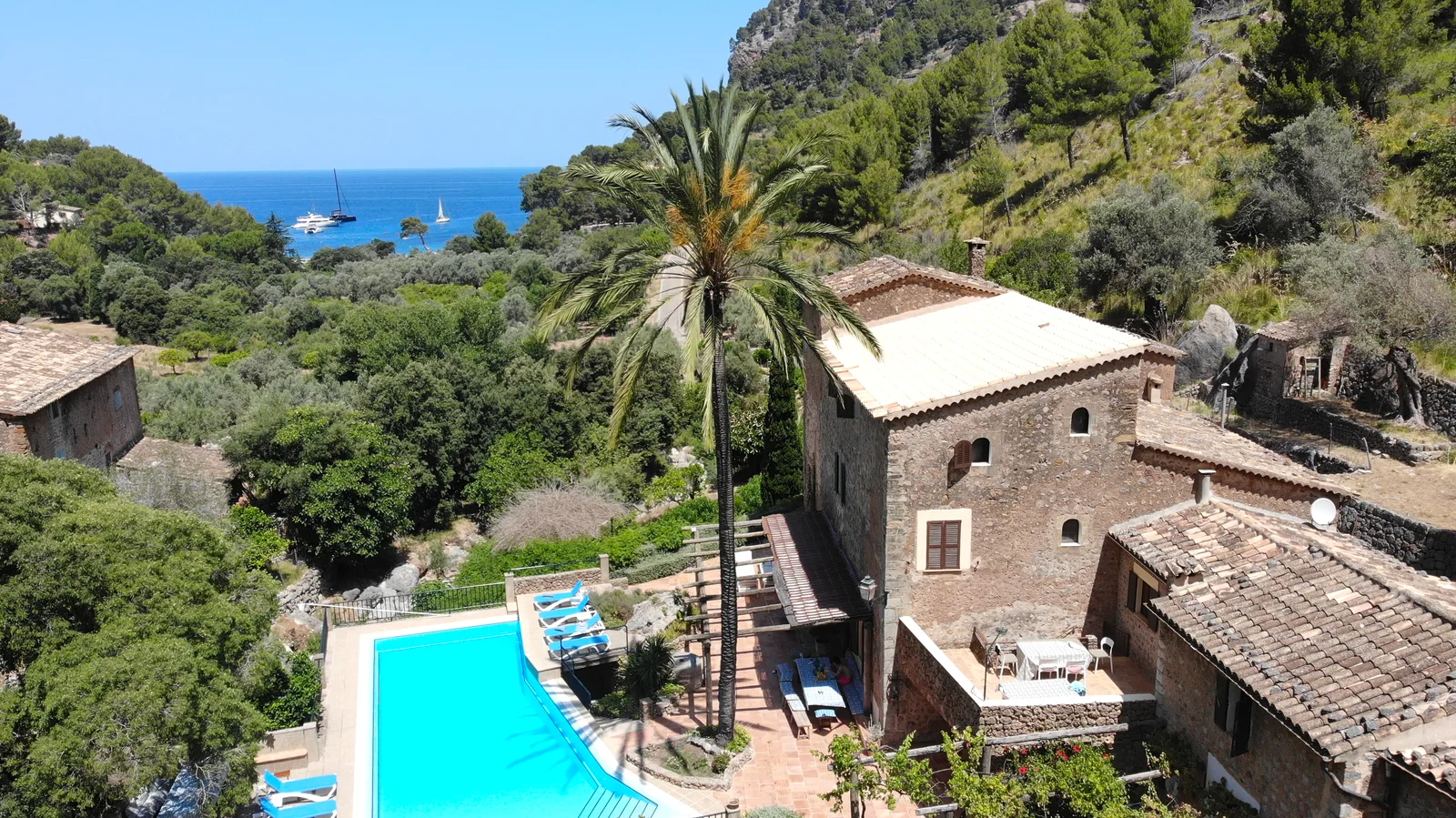 Aerial view of Finca Higo, a stone finca with pool above Cala Tuent, Mallorca