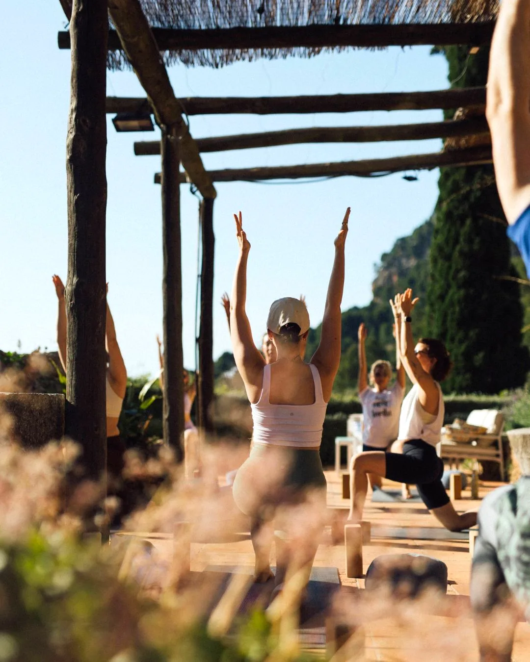 Yoga class under the pergola with Tramuntana mountain views, Mallorca retreat
