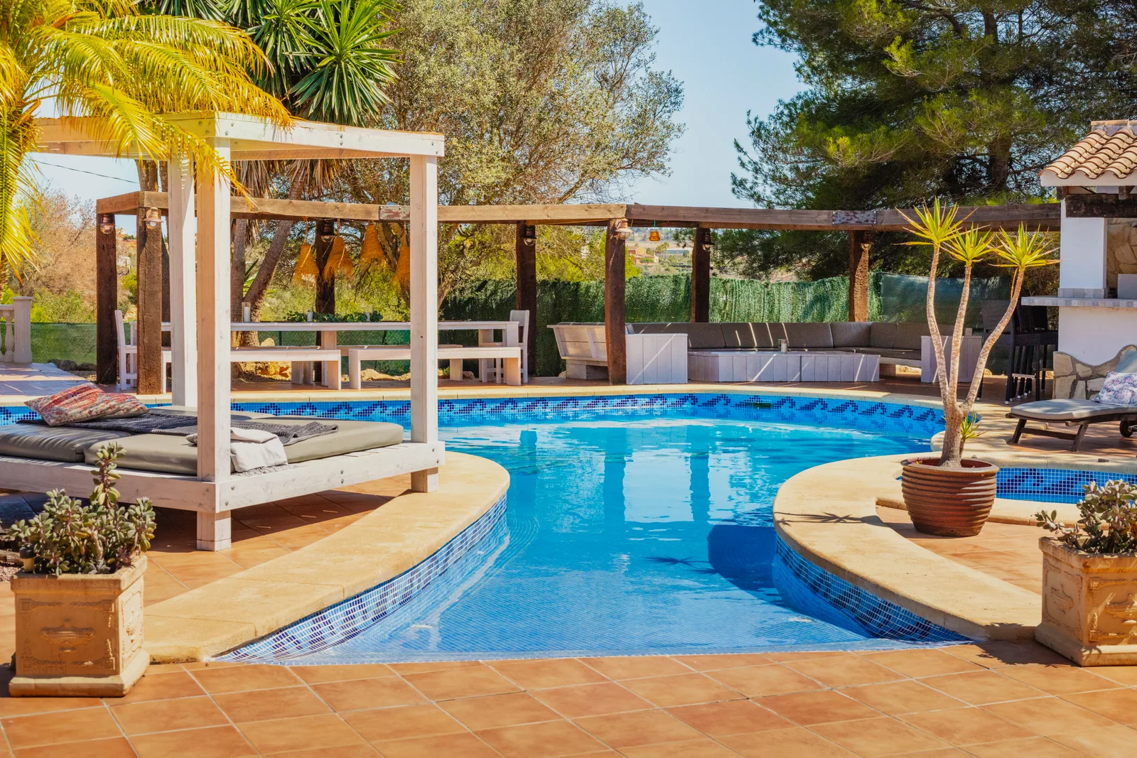 Lagoon-style pool and plunge pool with cabana bed at the Oodles villa, Spain