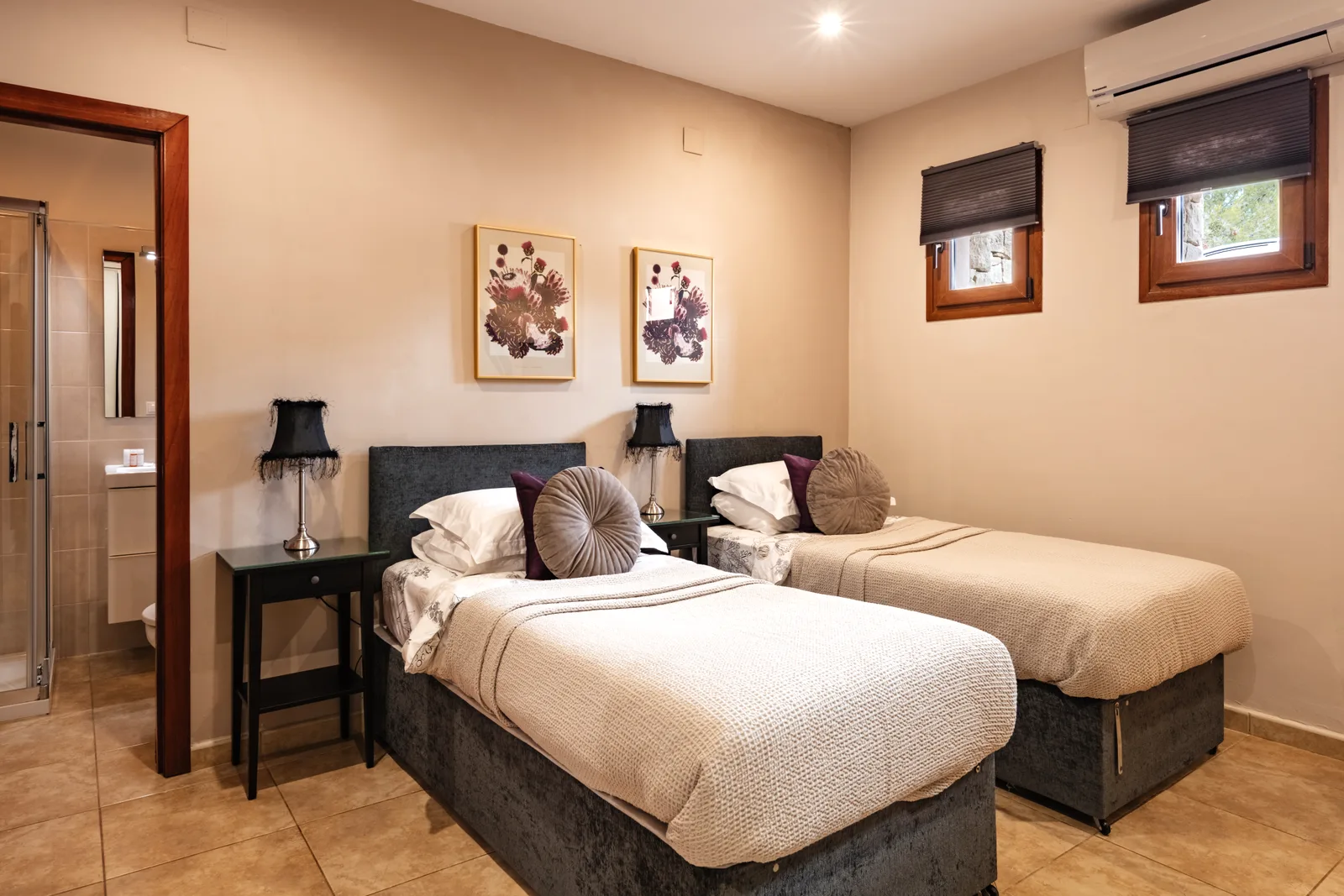 Twin bedroom with en-suite bathroom at the Oodles villa, Spain