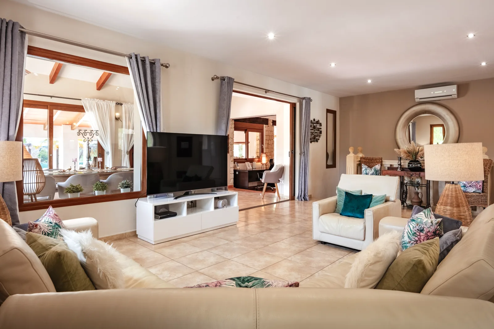 Living room lounge leading to the dining area at the Oodles villa, Spain