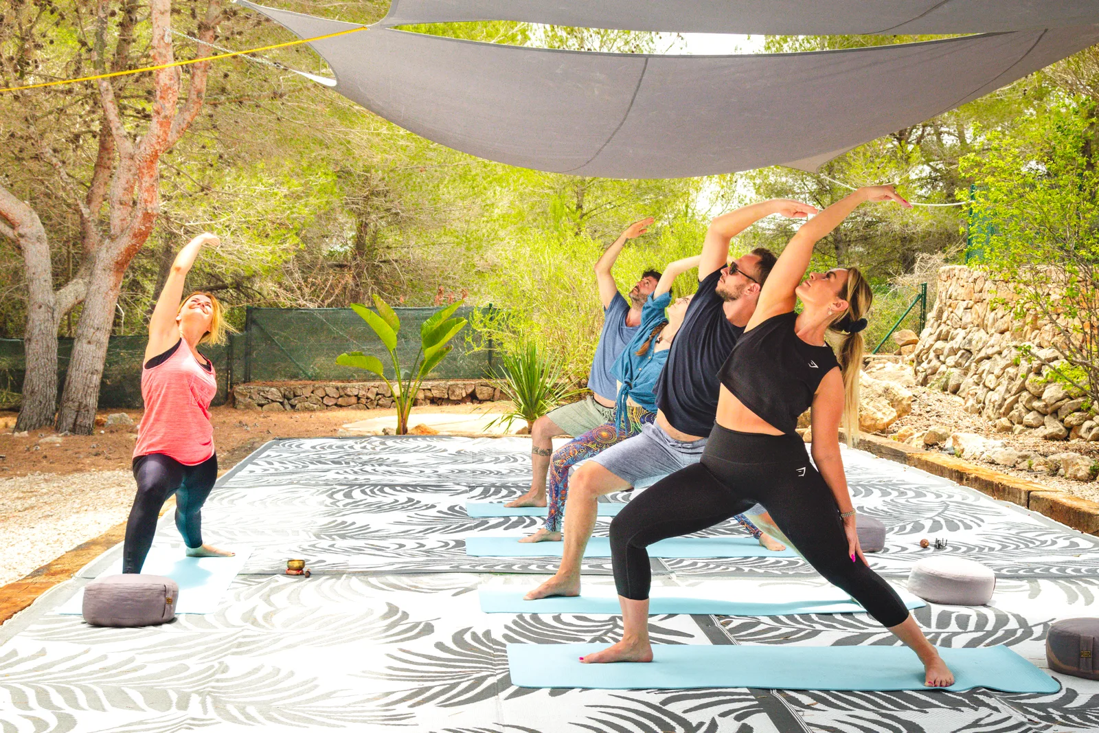 Morning yoga class on the covered outdoor deck at the Oodles villa, Spain