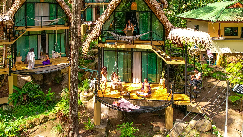 Aerial view of thatched jungle bungalows at Shivari, retreat venue on Koh Phangan, Thailand