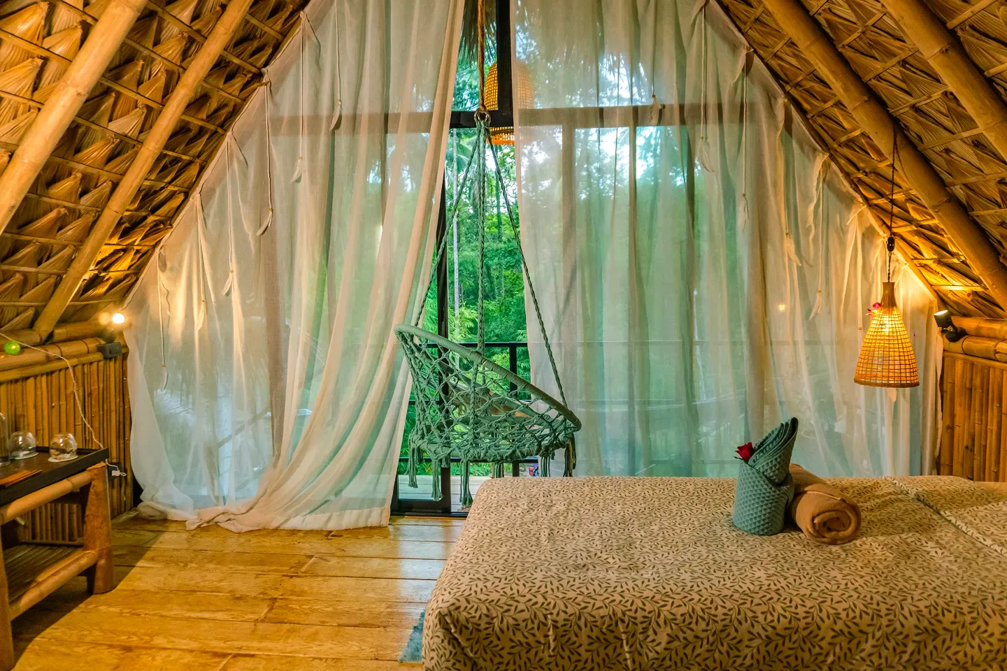 Bungalow bedroom with a jungle view at Shivari, Koh Phangan