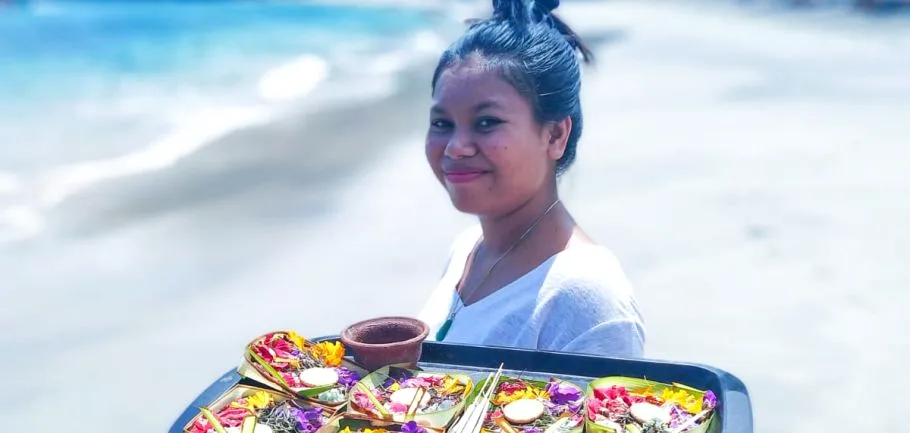 Balinese flower offerings on the beach — yoga retreat in Bali, Indonesia