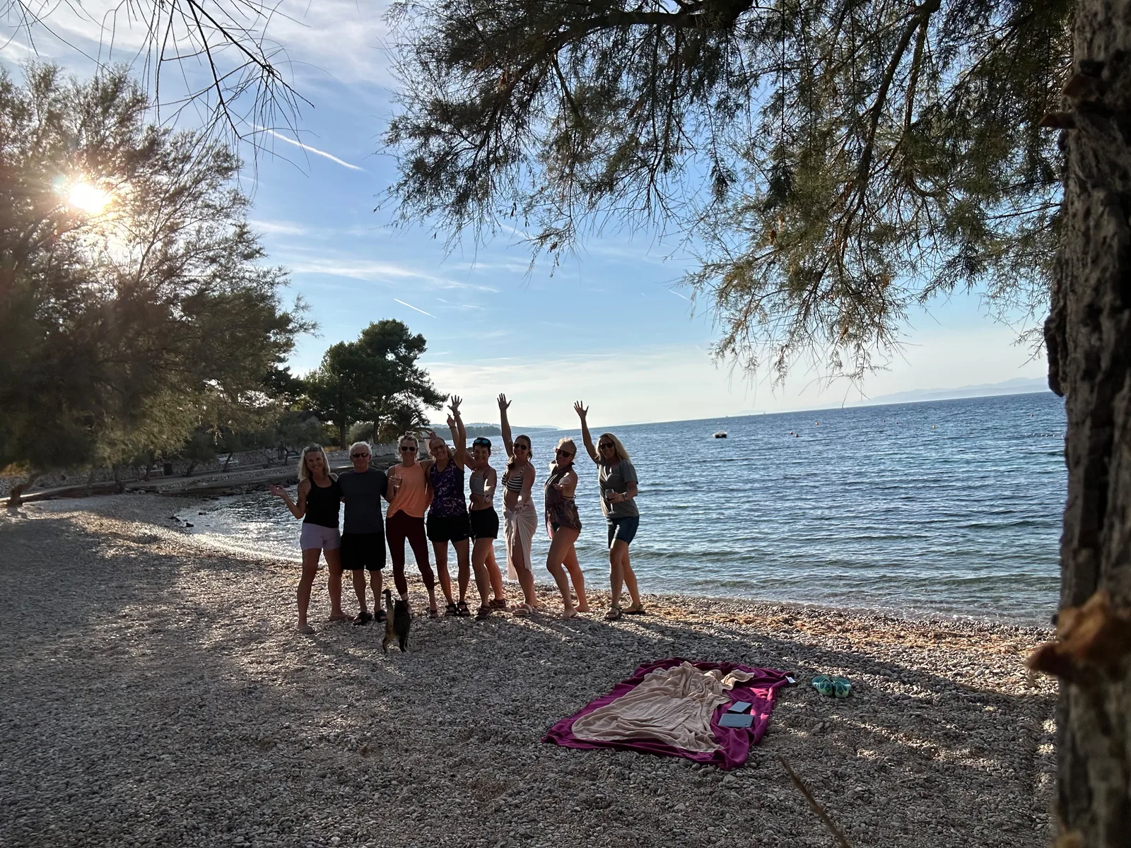 The group celebrating on the beach at sunset, Brač Island — Brač Balance retreat